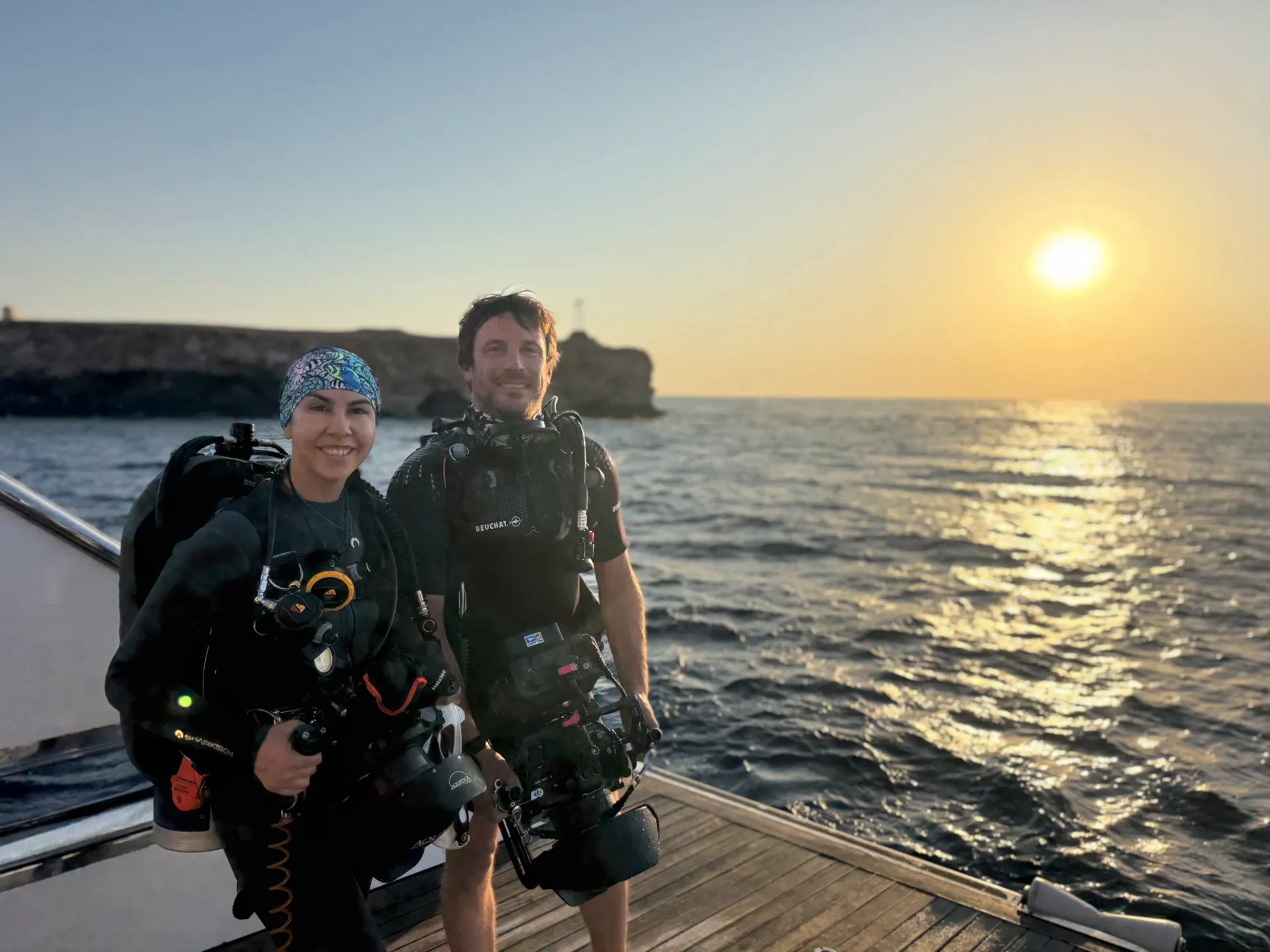 Happy divers on a liveaboard giving the OK sign — Blue Rides promise